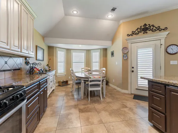 a kitchen with a stove and a microwave