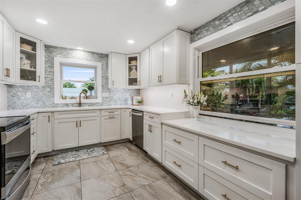 2020 Culberson Avenue Dunedin, FL 34698 - Photo 14 of 52 a kitchen with a sink and cabinets