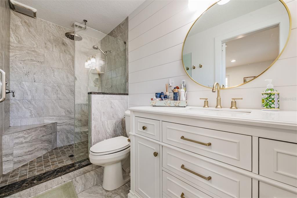 2020 Culberson Avenue Dunedin, FL 34698 - Photo 18 of 52 a bathroom with a sink a toilet and a mirror