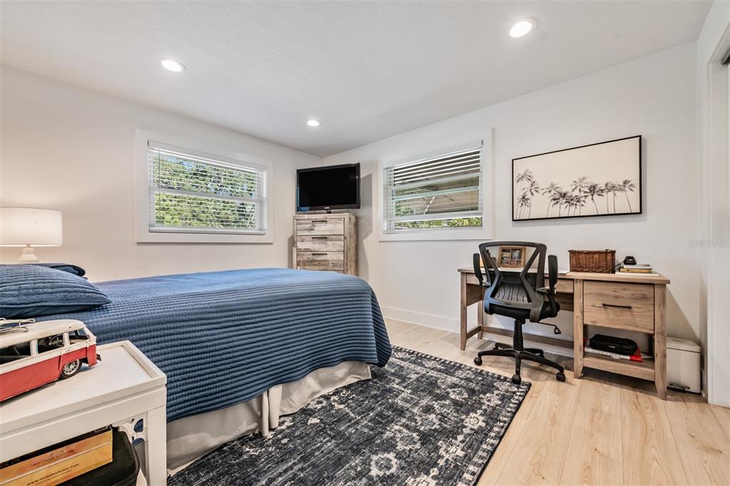 2020 Culberson Avenue Dunedin, FL 34698 - Photo 20 of 52 a bedroom with furniture and a wooden floor