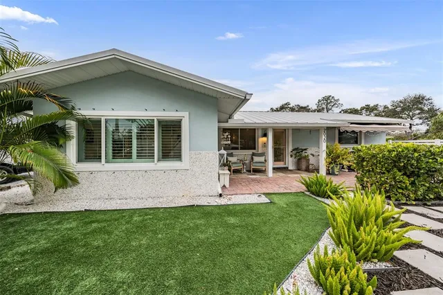 aerial view of multiple houses with a street