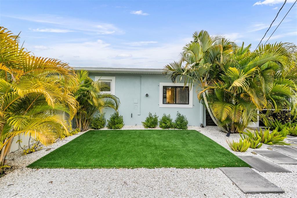 2020 Culberson Avenue Dunedin, FL 34698 - Photo 29 of 52 a front view of a house with garden