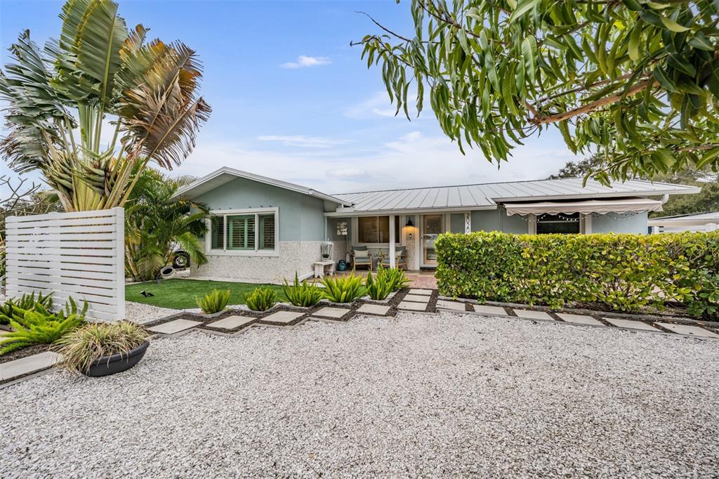 2020 Culberson Avenue Dunedin, FL 34698 - Photo 39 of 52 a front view of a house with garden