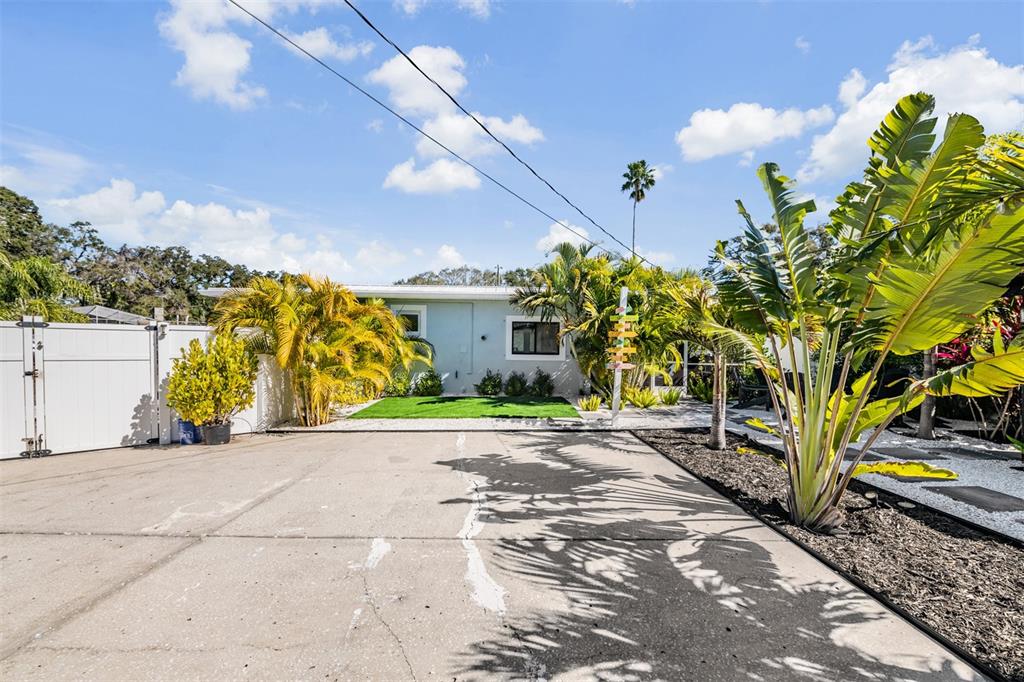 2020 Culberson Avenue Dunedin, FL 34698 - Photo 44 of 52 a view of a street with flower plants