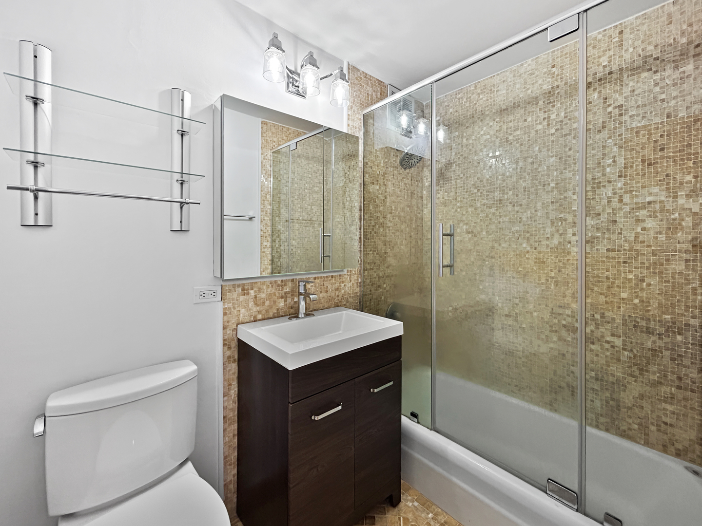 655 West Irving Park Road, Unit 3608 Chicago, IL 60613 - Photo 14 of 20 a bathroom with a sink a toilet and shower