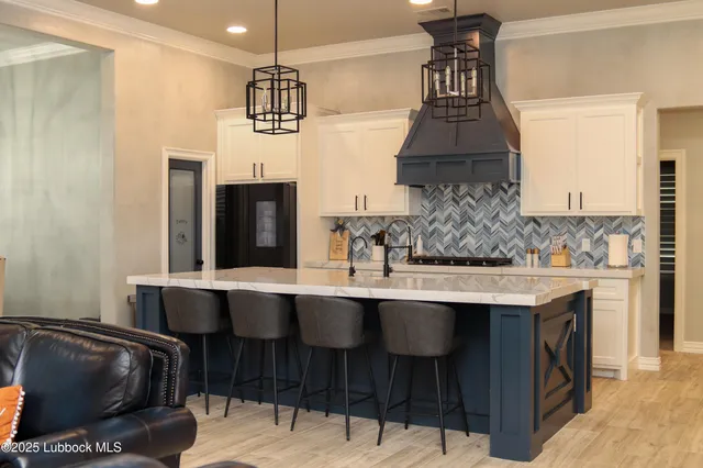 a kitchen with a sink cabinets and window