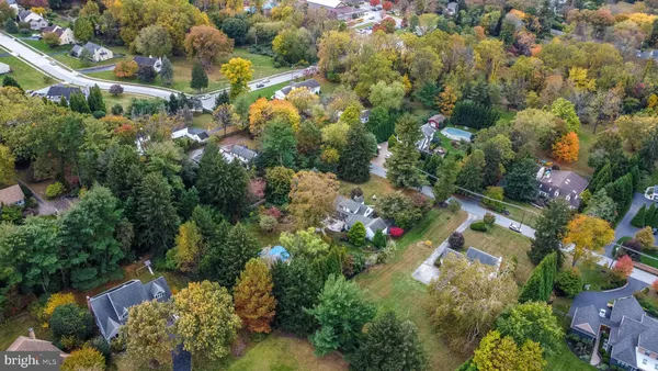 an aerial view of house with yard swimming pool and outdoor seating