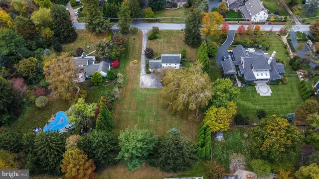 an aerial view of house with yard swimming pool and outdoor seating
