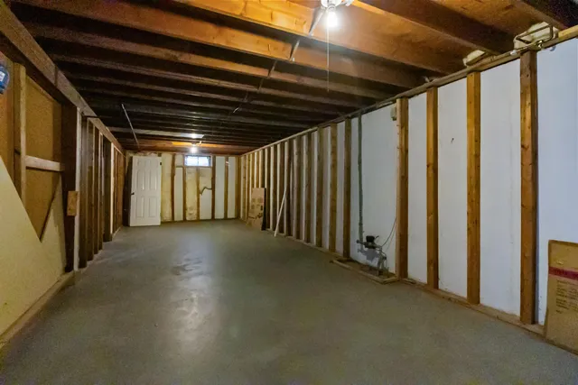 a view of empty room with wooden walls