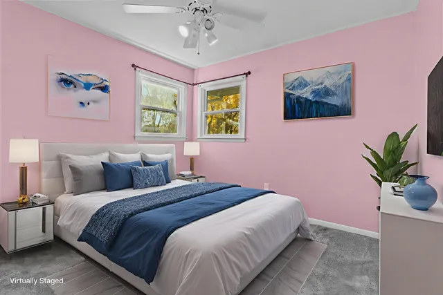 a bedroom with a bed and a potted plant