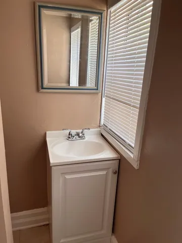 a utility room with a sink dryer and washer