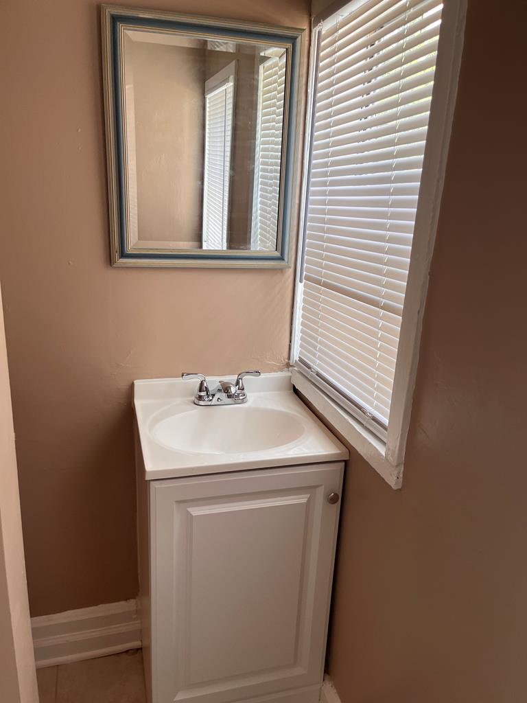 1231 18th Street, Unit D Columbus, GA 31901 - Photo 11 of 14 a utility room with a sink dryer and washer