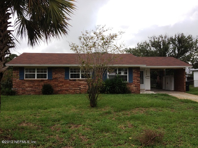 439 Irex Road Atlantic Beach, FL 32233 - Photo 1 of 12 a front view of a house with a garden