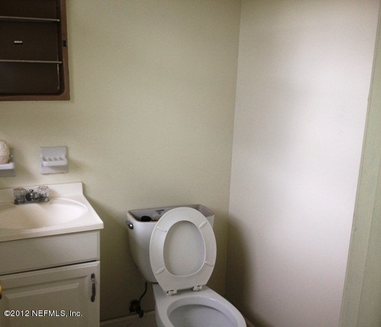 439 Irex Road Atlantic Beach, FL 32233 - Photo 5 of 12 a bathroom with a toilet and a sink