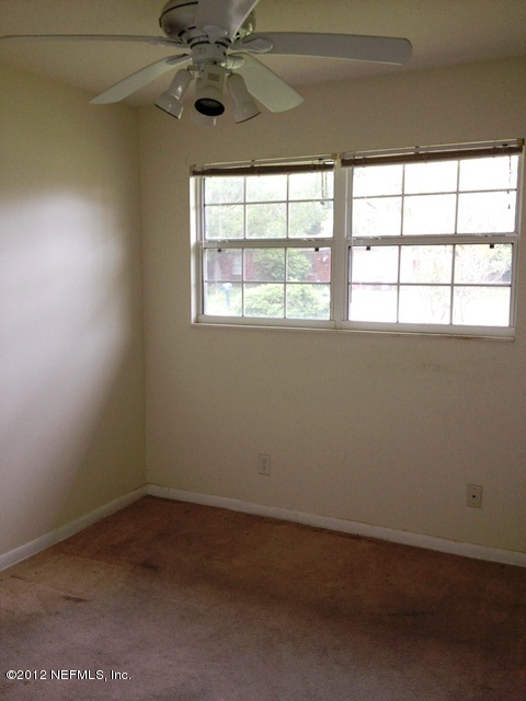 439 Irex Road Atlantic Beach, FL 32233 - Photo 7 of 12 an empty room with a window
