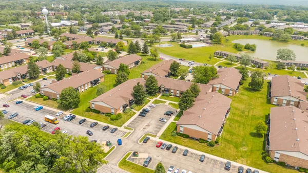 an aerial view of residential houses with outdoor space