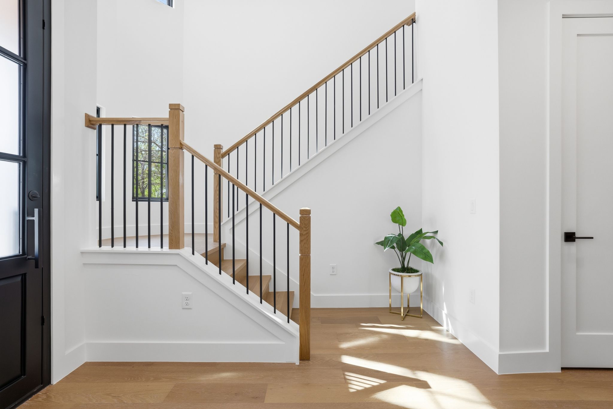 4500 Jinx Avenue Austin, TX 78745 - Photo 5 of 40 Entryway featuring light wood finished floors, healthy amount of natural light, and a high ceiling