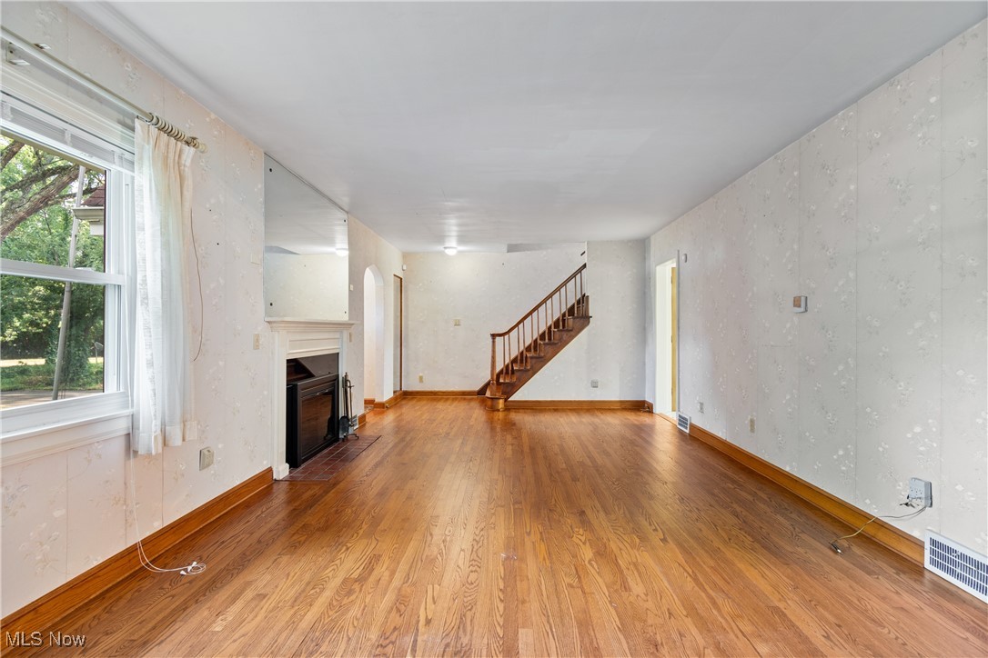 3550 Manchester Road Akron, OH 44319 - Photo 6 of 40 Unfurnished living room featuring hardwood / wood-style flooring