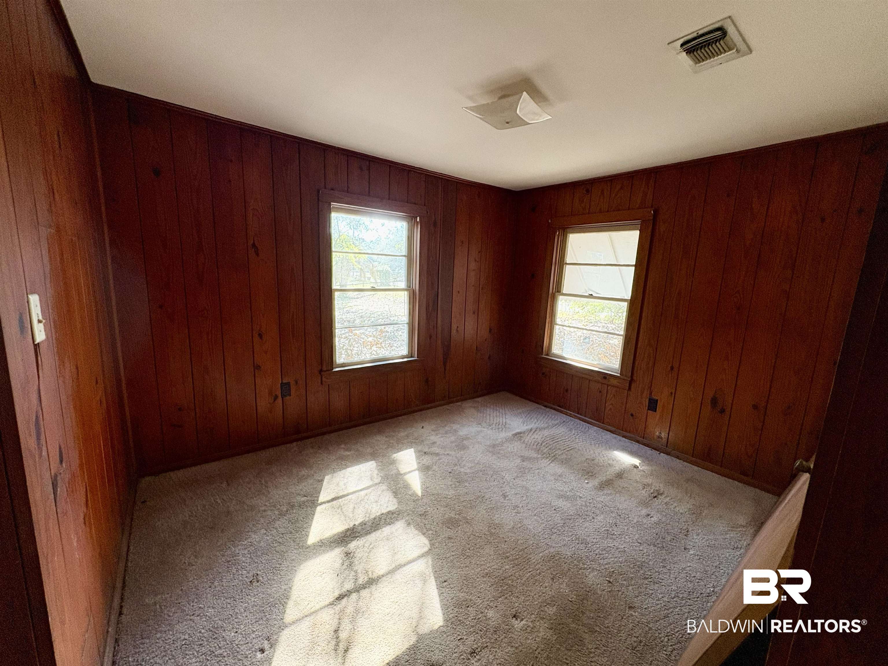 4060 Dickson Lane Mobile, AL 36618 - Photo 5 of 16 Spare room with wood walls and light colored carpet