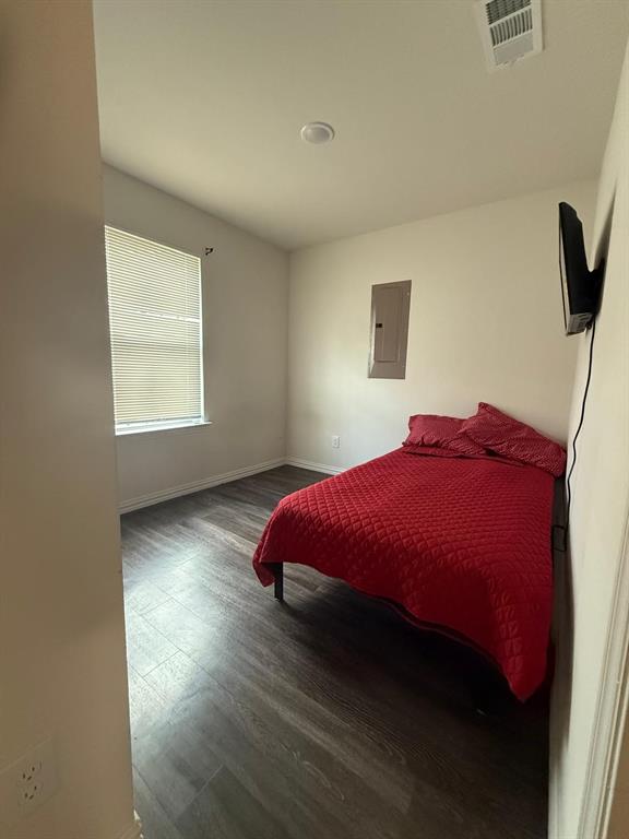 2614 Hooper Street Dallas, TX 75215 - Photo 11 of 13 a bedroom with a bed and a window