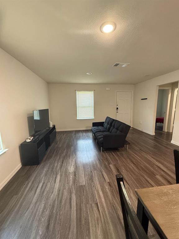 2614 Hooper Street Dallas, TX 75215 - Photo 5 of 13 a living room with furniture and a wooden floor