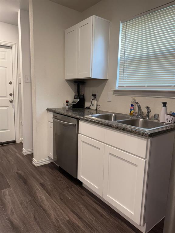 2614 Hooper Street Dallas, TX 75215 - Photo 7 of 13 a kitchen with stainless steel appliances granite countertop a sink stove and cabinets