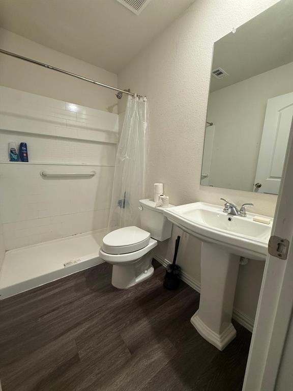 2614 Hooper Street Dallas, TX 75215 - Photo 10 of 13 a bathroom with a sink toilet and shower
