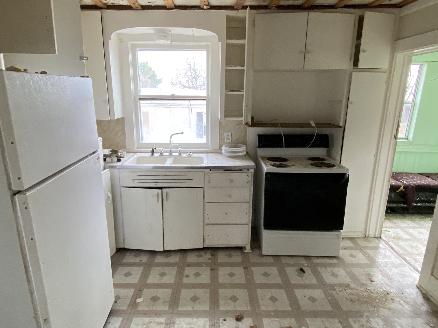 224 Poplar Street Ludlow, IL 60949 - Photo 8 of 9 a kitchen with a sink cabinets and a window