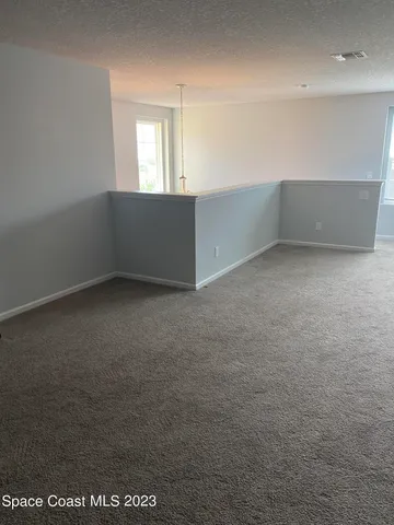 an empty room with a empty space and window