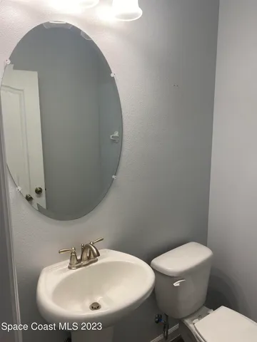 a bathroom with a toilet and a sink