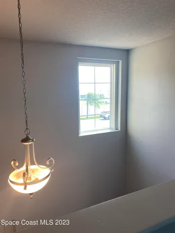 a view of a room with a chandelier