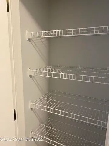 a view of small space with racks on the wall