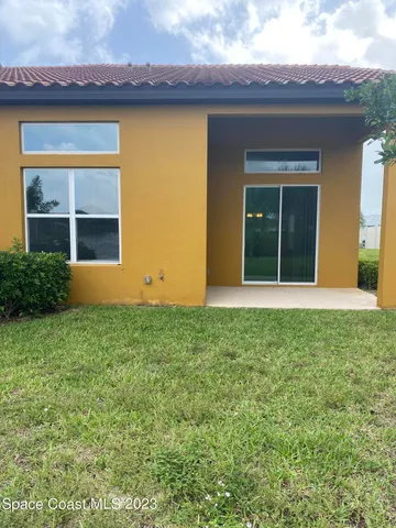 a backyard of a house with lots of green space