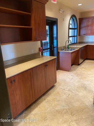 a lobby with furniture and window