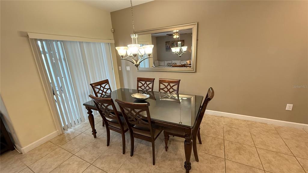 4794 Clock Tower Drive Kissimmee, FL 34746 - Photo 13 of 63 a view of a dining room with furniture and window