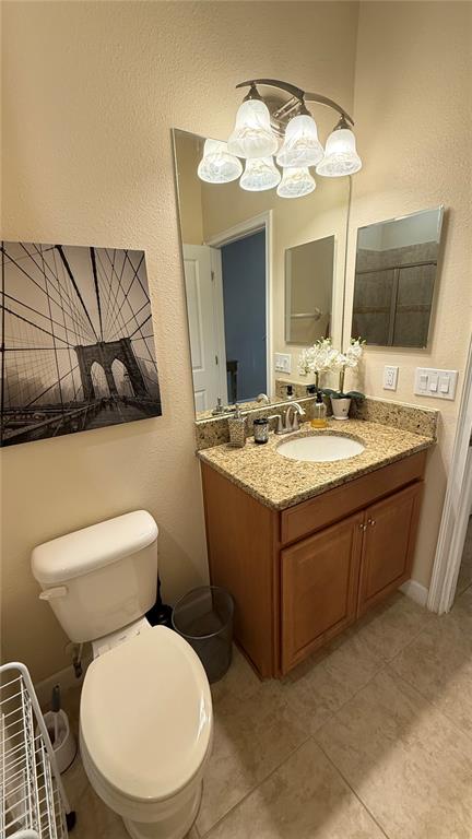 4794 Clock Tower Drive Kissimmee, FL 34746 - Photo 18 of 63 a bathroom with a toilet sink and mirror