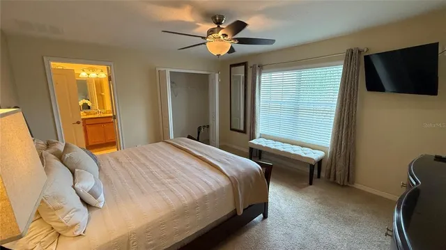 a bathroom with a toilet and vanity