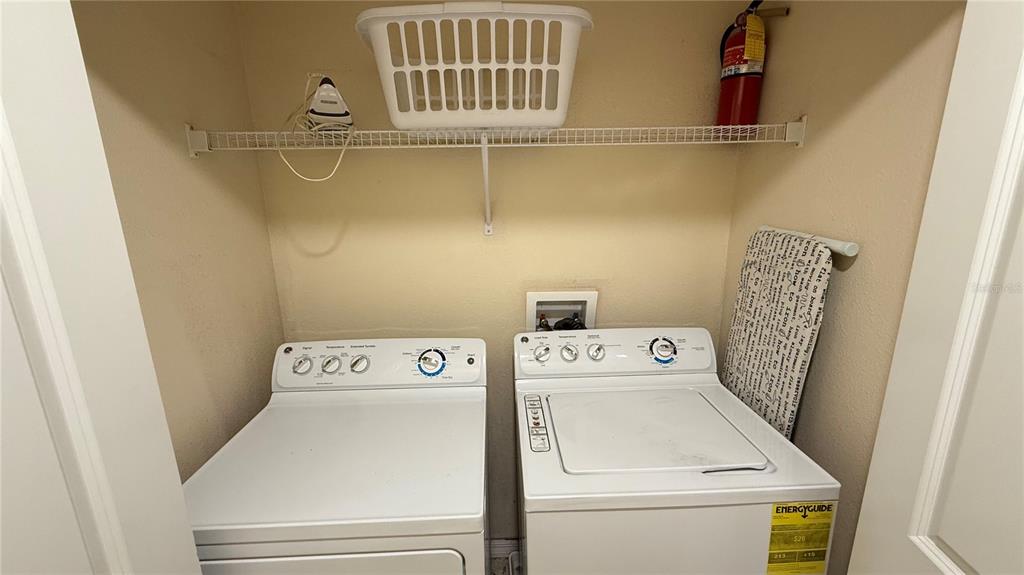 4794 Clock Tower Drive Kissimmee, FL 34746 - Photo 25 of 63 a utility room with dryer and washer