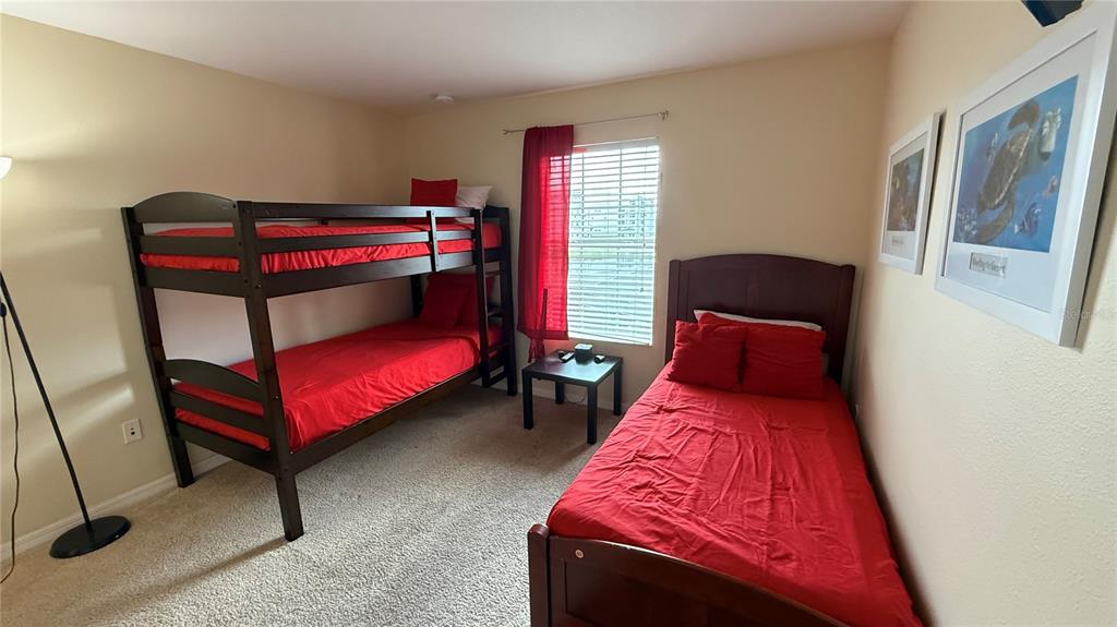 4794 Clock Tower Drive Kissimmee, FL 34746 - Photo 32 of 63 a bed room with a bed and a window