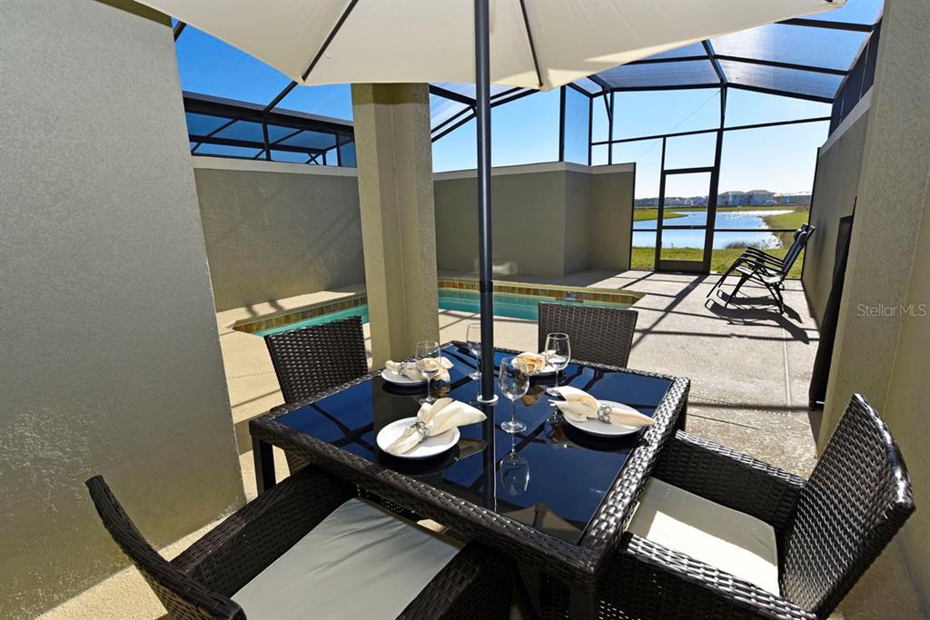 4794 Clock Tower Drive Kissimmee, FL 34746 - Photo 35 of 63 a view of a dining room with furniture window and outside view