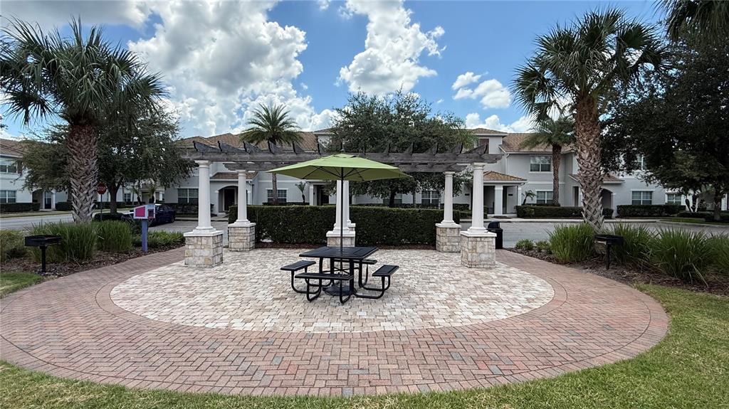 4794 Clock Tower Drive Kissimmee, FL 34746 - Photo 38 of 63 a view of a house with backyard porch and sitting area