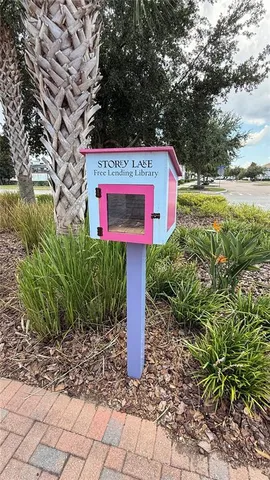 a view of swimming pool with a patio and a garden