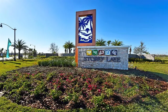 a view of a swimming pool and an outdoor seating