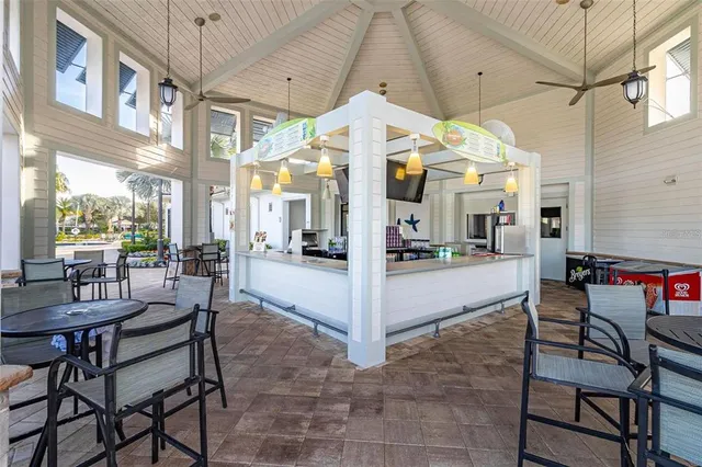 a view of a swimming pool with a table and chairs