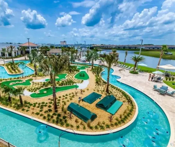 a view of a swimming pool with a lounge chairs