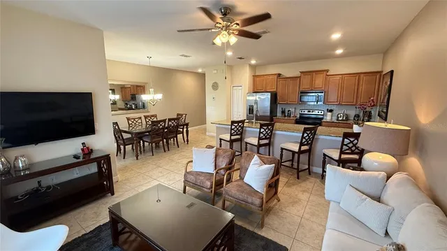 a living room with lots of furniture and a chandelier