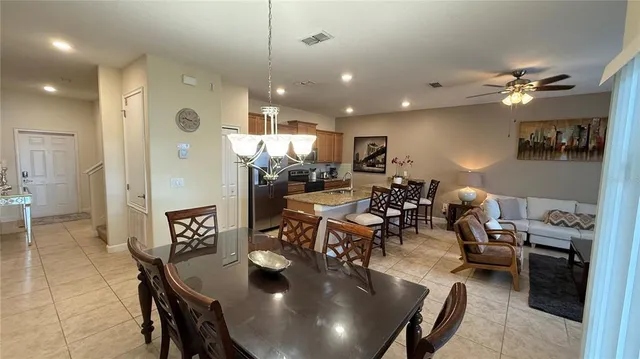a kitchen with stainless steel appliances granite countertop a stove a refrigerator and a microwave