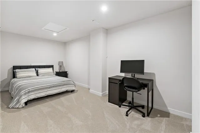 a bedroom with a workspace