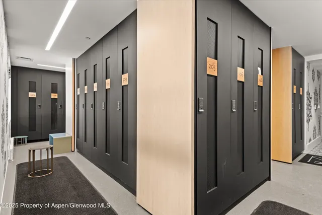 a view of a hallway with bathroom