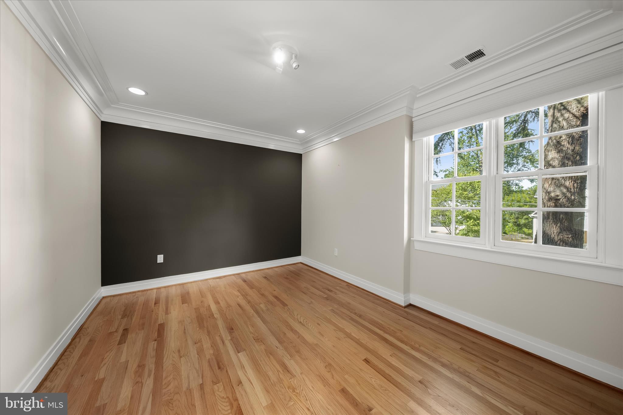 5104 Scarsdale Road Bethesda, MD 20816 - Photo 45 of 68 a view of empty room with wooden floor